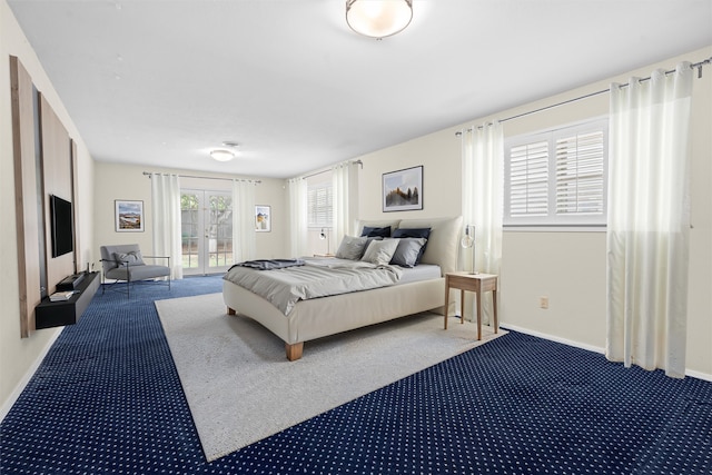 carpeted bedroom with french doors