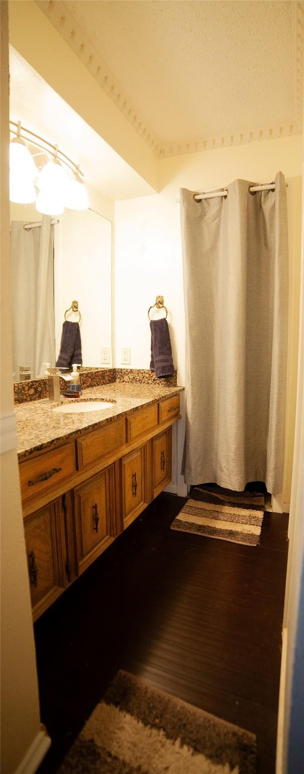 bathroom with vanity and concrete floors