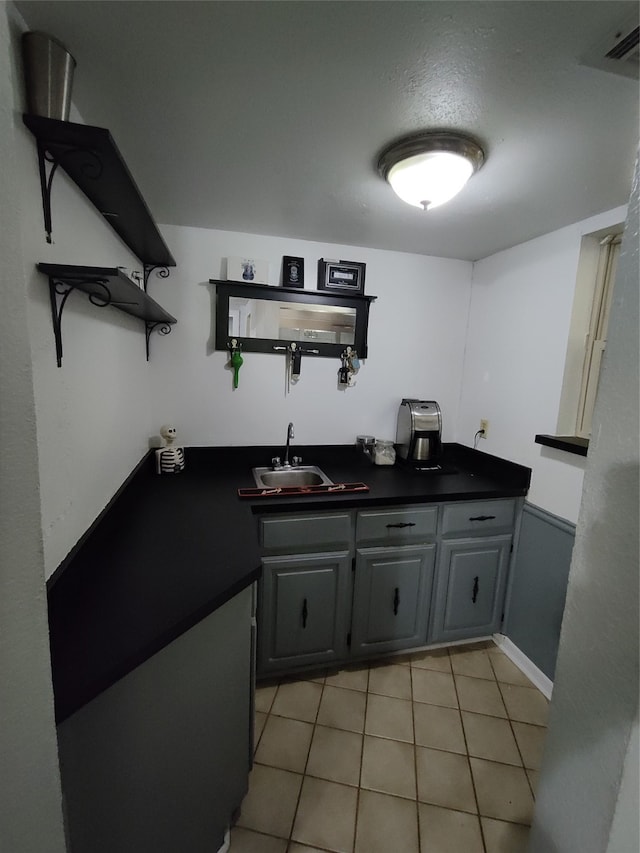 bathroom featuring tile patterned flooring and sink