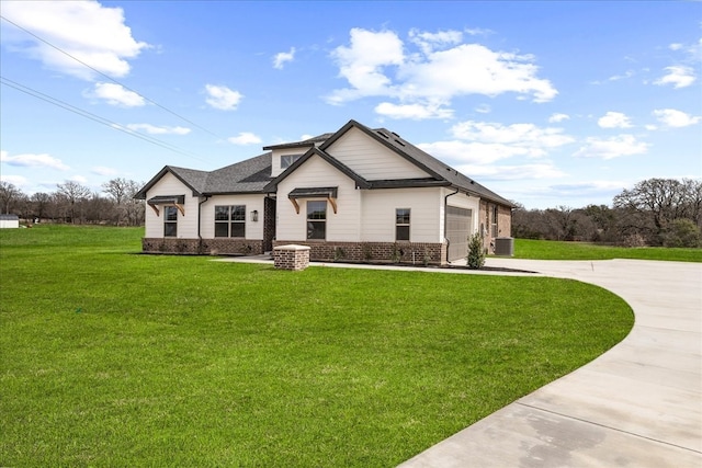 view of front of house featuring brick siding, a front lawn, central AC unit, a garage, and driveway