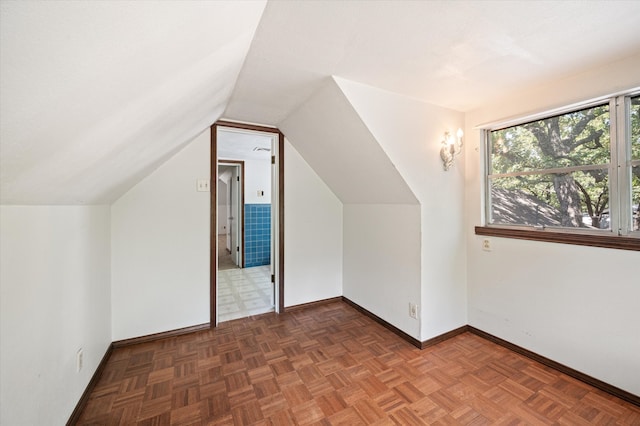 additional living space with parquet floors and lofted ceiling