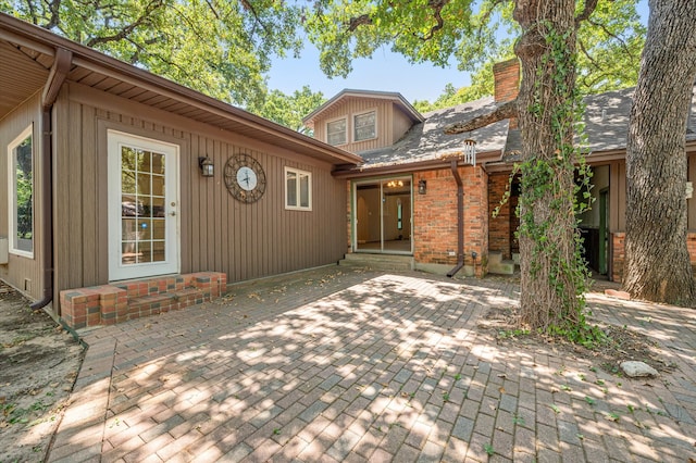 back of property with a patio area