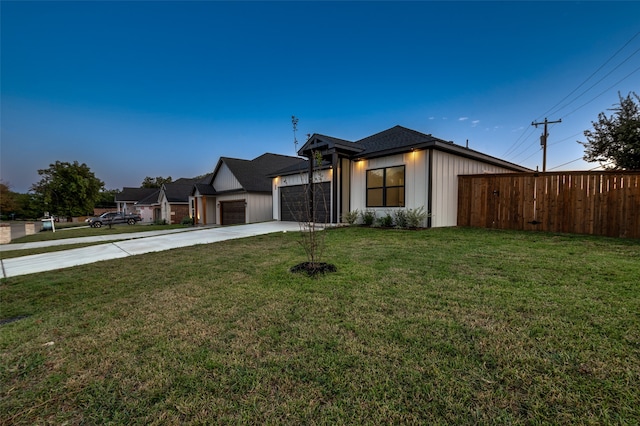 view of front of house with a garage and a front yard