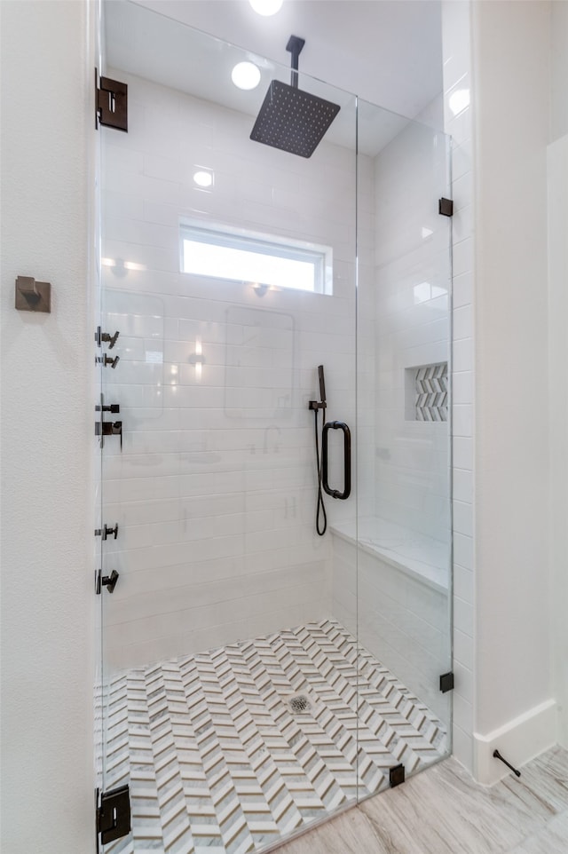 bathroom featuring an enclosed shower