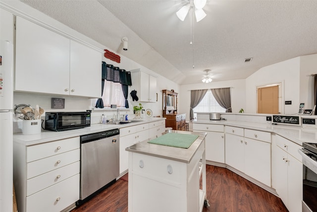 kitchen with a center island, sink, stainless steel dishwasher, dark hardwood / wood-style floors, and ceiling fan