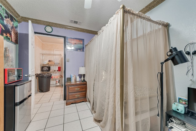 bathroom featuring a textured ceiling, vanity, and tile patterned floors