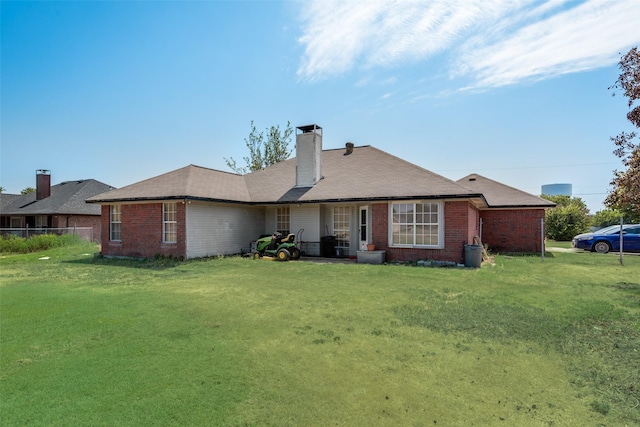 201 Anita Ln, Waxahachie, TX 75165 - rear view of property with brick siding, a lawn, and a chimney
