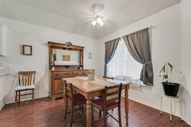 dining room with a textured ceiling, ceiling fan, and dark wood-type flooring