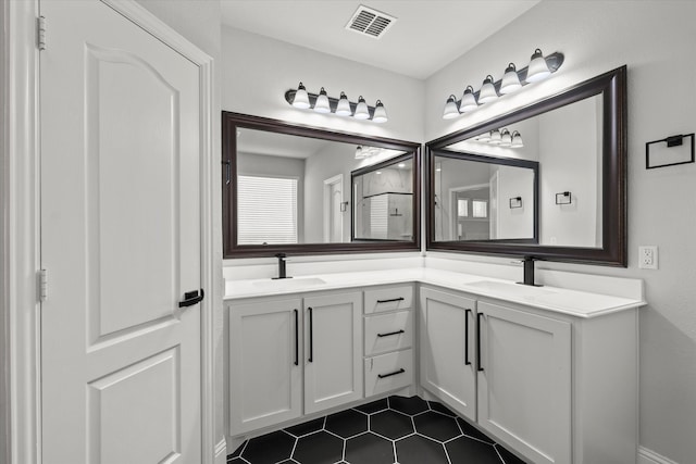 bathroom with tile patterned flooring and vanity