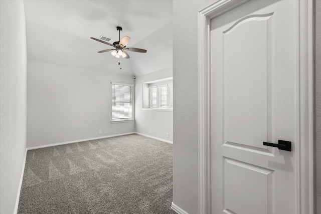 carpeted spare room with lofted ceiling and ceiling fan