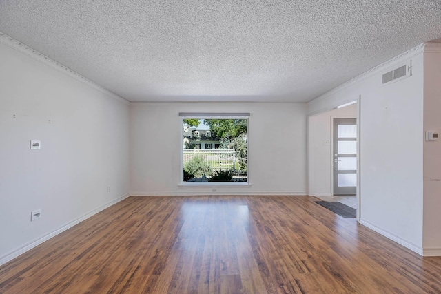 unfurnished room with a textured ceiling and dark hardwood / wood-style floors