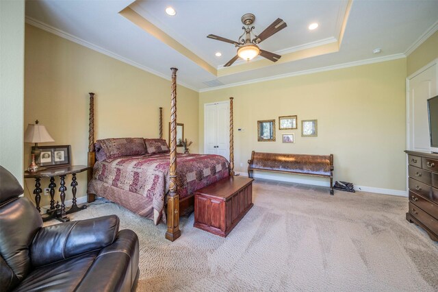 bedroom featuring carpet flooring, a raised ceiling, and crown molding