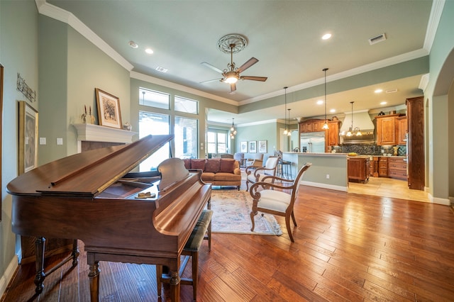 miscellaneous room featuring light tile patterned floors, ornamental molding, and ceiling fan