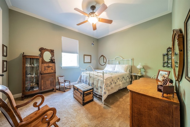 bedroom with carpet flooring, ceiling fan, and crown molding