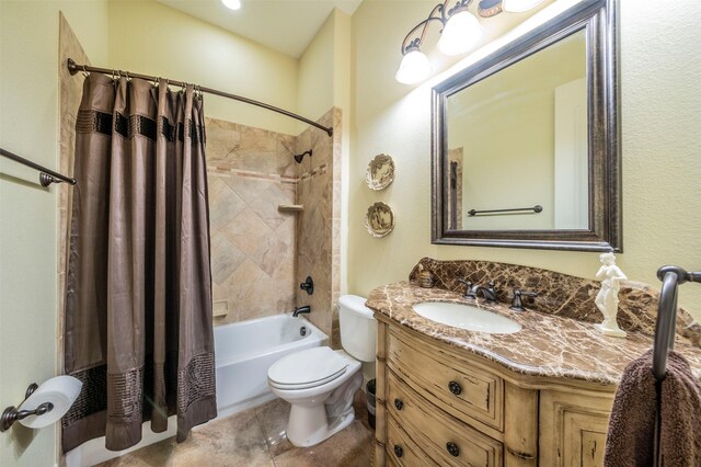 full bathroom with tile patterned flooring, shower / bath combination with curtain, vanity, and toilet