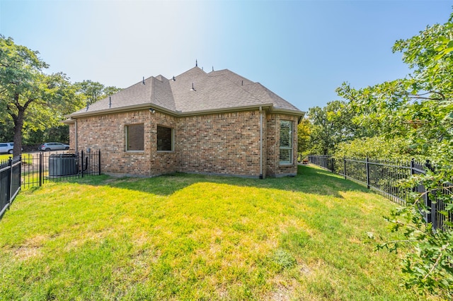 back of property featuring a lawn