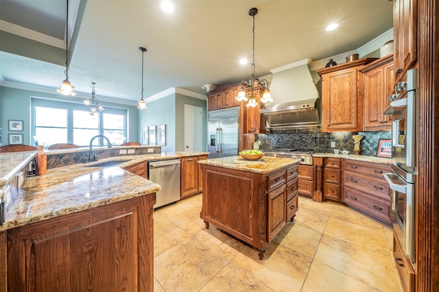 kitchen with stainless steel appliances, a spacious island, tasteful backsplash, sink, and wall chimney range hood