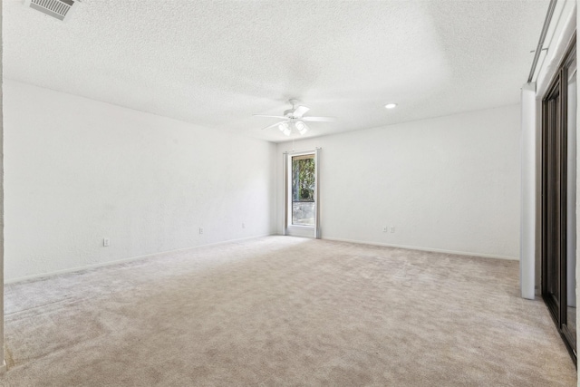 unfurnished room featuring recessed lighting, visible vents, a ceiling fan, light carpet, and a textured ceiling