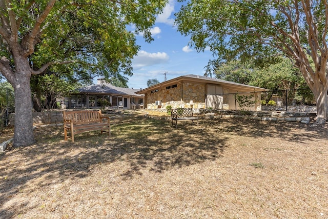 exterior space featuring stone siding