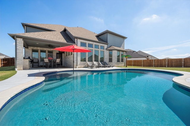 view of swimming pool with a fenced backyard, a fenced in pool, and a patio