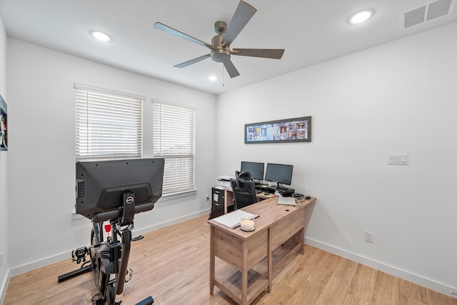 home office featuring light wood-type flooring and ceiling fan