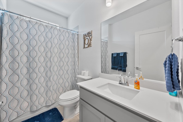 bathroom with vanity, toilet, a shower with shower curtain, and tile patterned floors