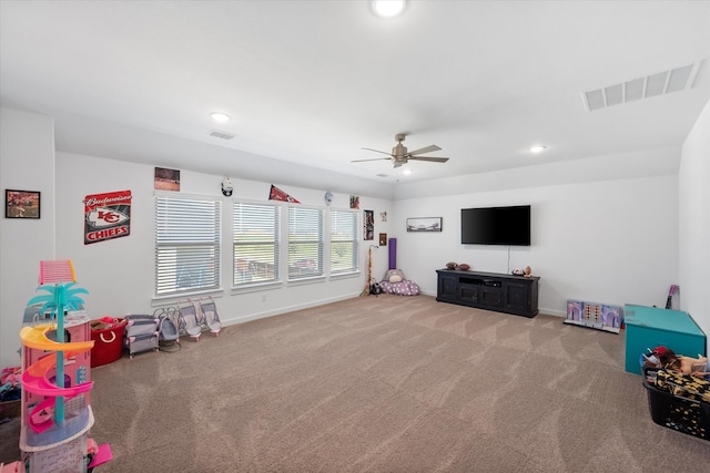 game room with carpet and ceiling fan