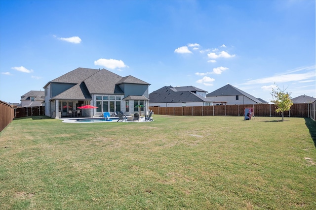 view of yard featuring a fenced in pool and a patio