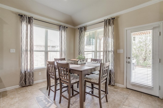 dining room featuring vaulted ceiling and light tile patterned floors