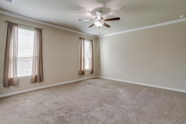 carpeted empty room featuring ceiling fan and ornamental molding