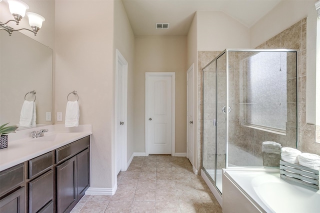 bathroom featuring a notable chandelier, separate shower and tub, vanity, and tile patterned floors