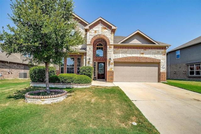 view of front of property featuring a front yard and a garage