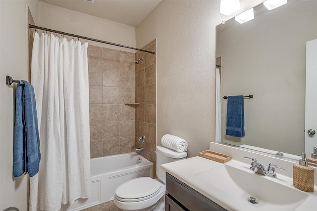 full bathroom featuring shower / bath combo with shower curtain, vanity, and toilet