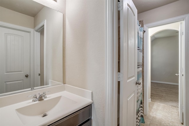 bathroom with tile patterned flooring and vanity