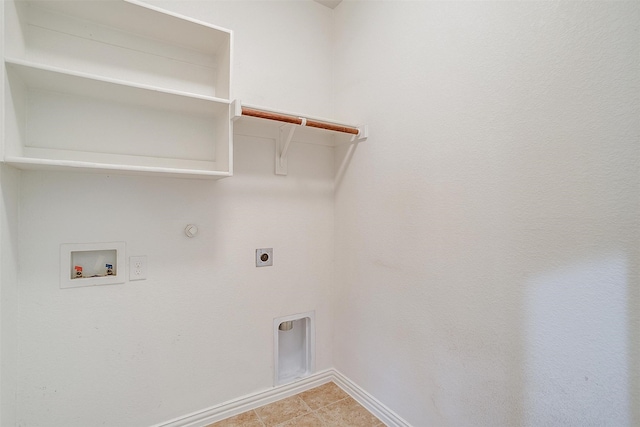 washroom with hookup for an electric dryer, washer hookup, light tile patterned flooring, and hookup for a gas dryer