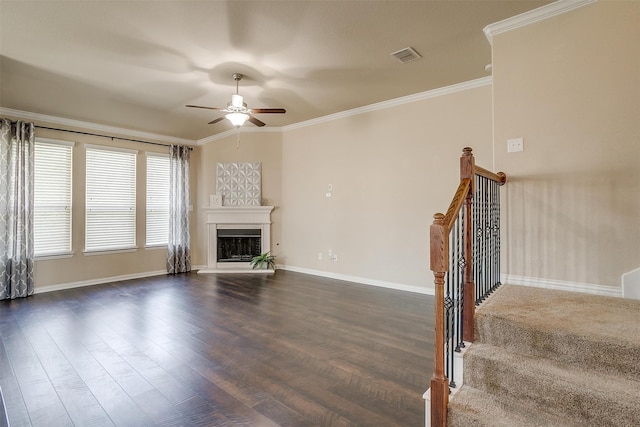 unfurnished living room with ceiling fan, hardwood / wood-style floors, and ornamental molding