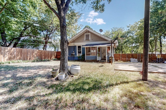 back of house featuring a patio and fence