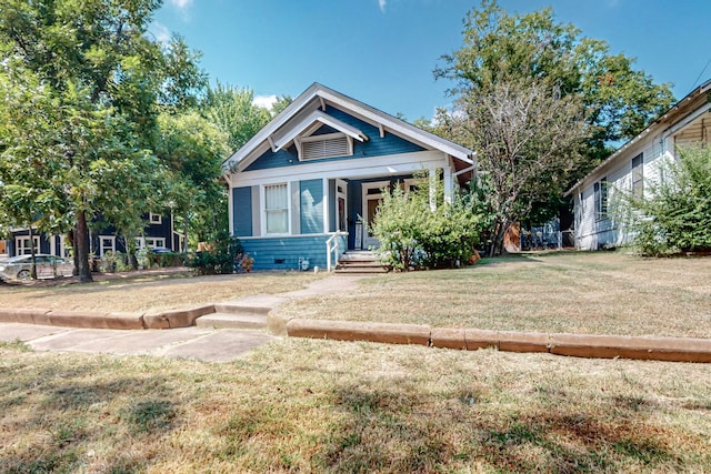 view of front of house with a porch and a front yard