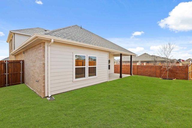 back of property featuring a patio and a lawn