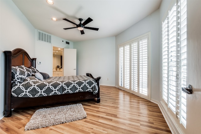 bedroom featuring hardwood / wood-style floors and ceiling fan