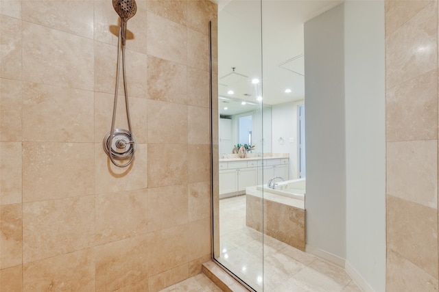 bathroom with vanity, shower with separate bathtub, and tile patterned flooring