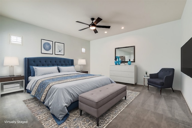 bedroom featuring ceiling fan and dark colored carpet