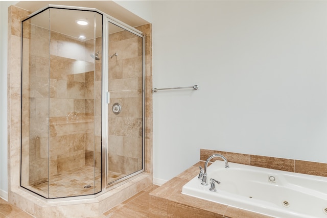 bathroom featuring separate shower and tub and tile patterned flooring