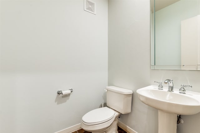 bathroom with sink and toilet