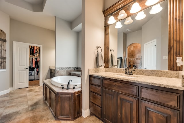 bathroom with a bath and vanity