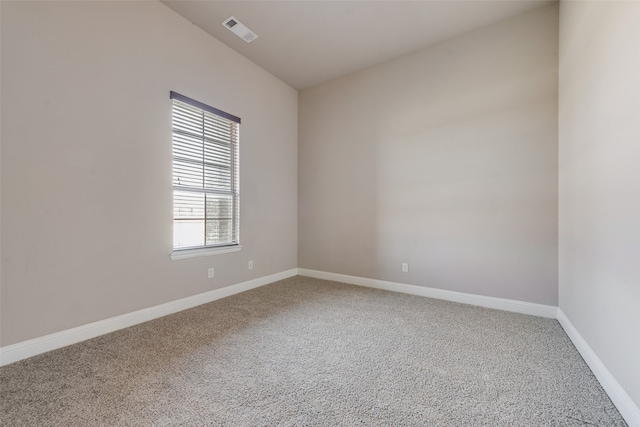 empty room with carpet flooring