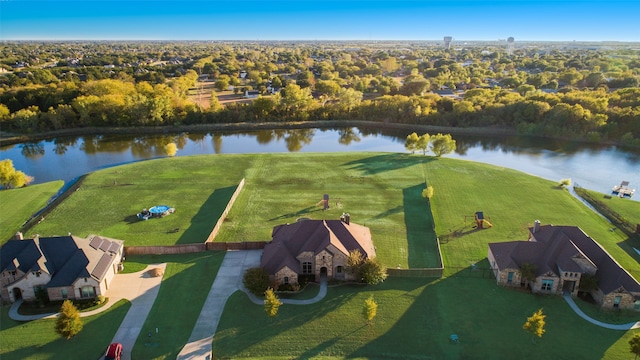 birds eye view of property with a water view