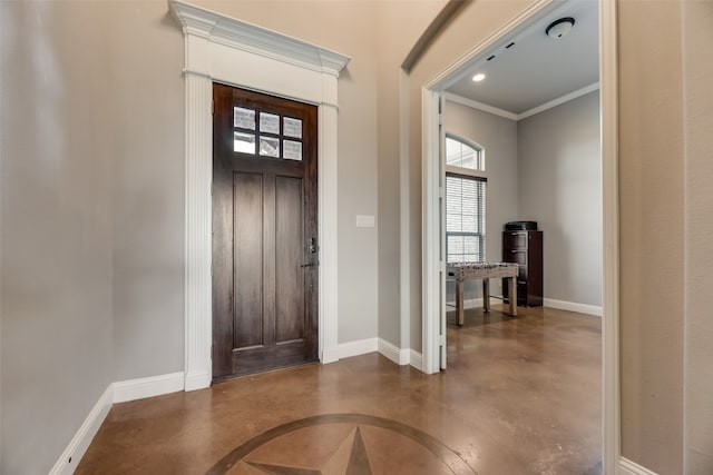 entryway featuring crown molding