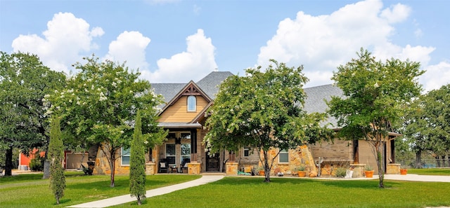 craftsman-style house with a front lawn