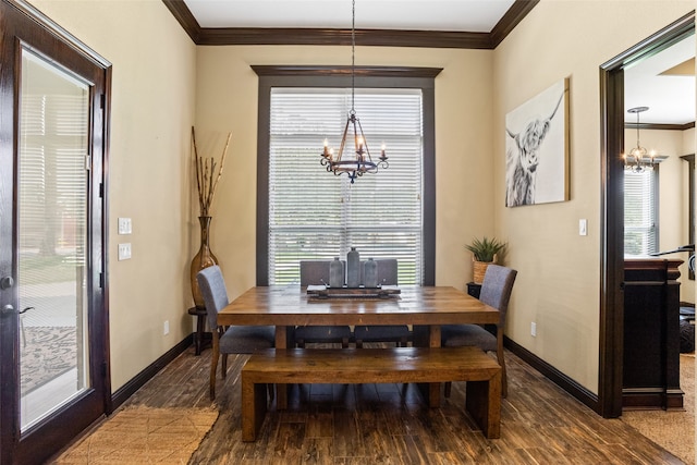 dining area with plenty of natural light, a chandelier, ornamental molding, and hardwood / wood-style flooring